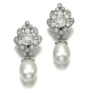 A pair of natural pearl and diamond earrings with two drop-shaped saltwater natural pearls